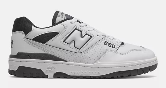 Side view of white and black New Balance shoe.